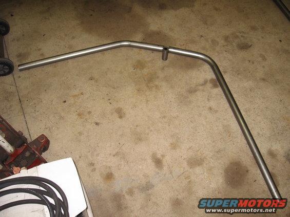 Metal exhaust pipe bent into a U-shape with a small vertical pipe attached