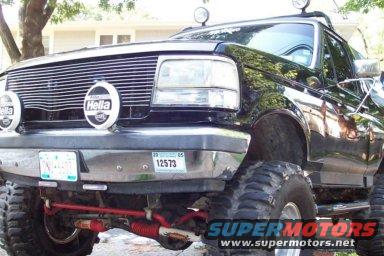 Black Ford Bronco with aftermarket grille and lights. License plate visible