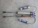 1985 Ford Bronco II - Two pairs of Fox Racing Shox shock absorbers are laid out on a concrete surface.