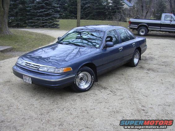 Blue 1996 Ford Crown Victoria sedan, 3q-front view. License plate reads 498-RCV