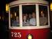 1994 Ford Probe - A group of people are visible inside a vintage streetcar, with the number 725 displayed on its side.