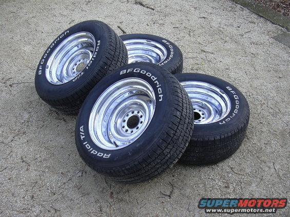 Four chrome wheels with BFGoodrich Radial T/A tires on the ground