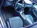 1984 BMW 3 Series - The interior of a Mercedes-Benz C32 AMG features leather seats and a branded floor mat.