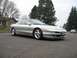 1994 Ford Probe - This silver 1994 Ford Probe GT is parked on a street with trees and houses visible.