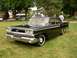 1959 Ford Fairlane - This 1959 Ford Fairlane sedan features a distinctive chrome grille and sharp tail fins, characteristic of late 1950s automotive design.