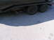 1995 Ford C-350 (Centurion Conversions) - Trailer axle repair needed, one wheel is missing from the axle assembly.