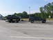 1995 Ford C-350 (Centurion Conversions) - A Ford Bronco is being transported on a trailer by a Ford E-Series van.