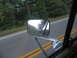 1995 Ford C-350 (Centurion Conversions) - Side mirror reflection shows a pickup truck on the road ahead.