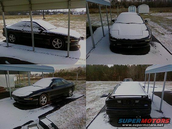1993 Ford Probe parked under a carport with snow on its body