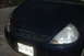 2002 Ford Coupe - Front view of a dark blue 2002 Ford Ka, showing the grille and headlights.