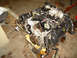 1992 Ford Crown Victoria - Engine assembly with various components and wiring, resting on wooden supports.