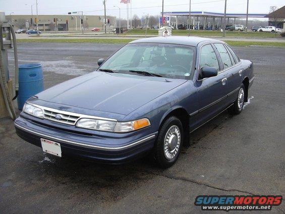 1996 Ford Crown Victoria sedan, blue, parked outdoors