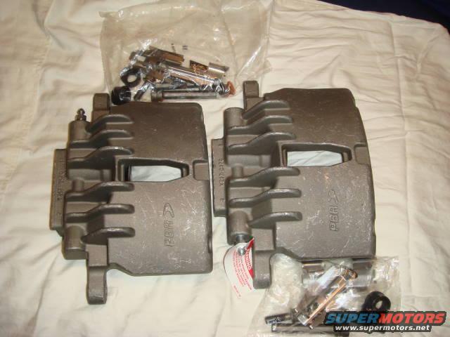 Pair of gray brake calipers with hardware kit