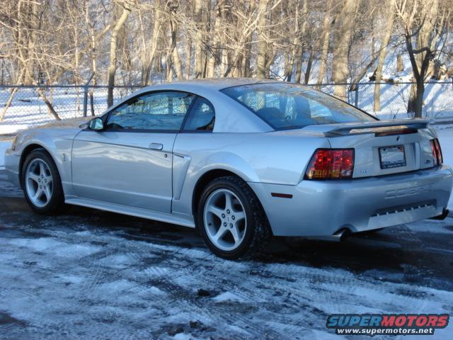 Silver 1999 Ford Mustang Cobra rear 3/4 view in snow
