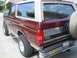 1996 Ford Bronco - This Ford Bronco has a two-tone paint job and a spare tire mounted on the rear.