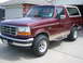 1996 Ford Bronco - This maroon Ford Bronco features tan lower body trim and chrome accents.