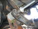1996 Ford Bronco - Detail of a vehicle's suspension system, possibly during a lift installation or repair.