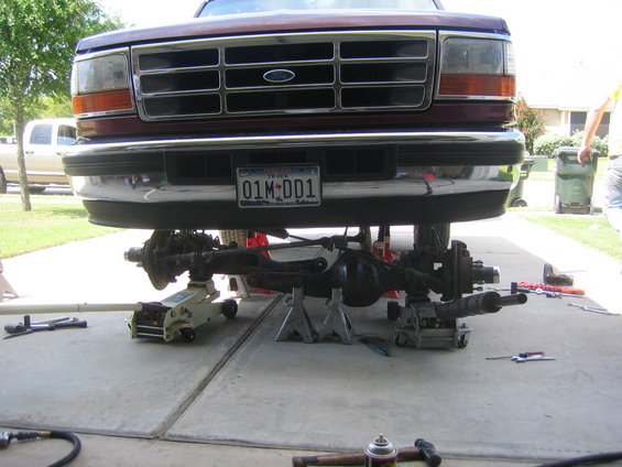 1996 Ford Bronco front end lifted on jack stands with axle removed for service