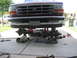 1996 Ford Bronco - Front axle and suspension components of a 1996 Ford Bronco are visible while the vehicle is lifted for maintenance.