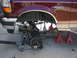 1996 Ford Bronco - The front suspension of a 1996 Ford Bronco is disassembled and supported by various jacks and stands.