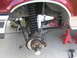 1996 Ford Bronco - Front suspension of a 1996 Ford Bronco, showing lifted coil springs and new shocks during a lift install.