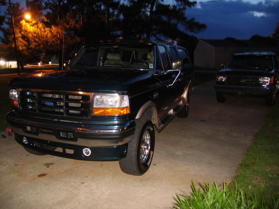 Dark green 1995 Ford C-350 Centurion Conversions SUV, 3q-front view
