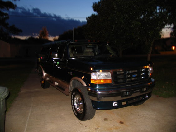 1995 Ford C-350 (Centurion Conversions) parked on driveway at dusk