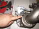 1996 Ford Probe - A turbocharger part is shown, with a finger indicating a specific area. Part number 617195 is visible.