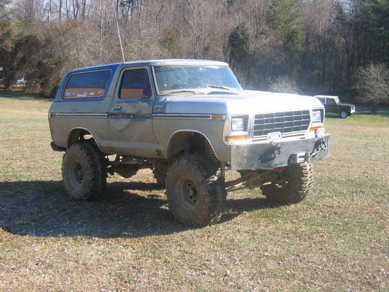 Lifted 1978 Ford Bronco with large tires and custom bumper