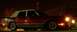 1989 Lincoln Town Car - This 1989 Lincoln Town Car is captured in a three-quarter front view at night, highlighting its classic design.