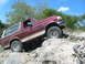 1996 Ford Bronco - This 1996 Ford Bronco navigates a challenging rocky trail, its off-road capabilities.