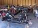 1992 Lincoln Custom - The chassis of a vehicle is shown on stands in a workshop, undergoing restoration or repair.