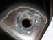 1992 Lincoln Custom - Close-up of a fuel filler neck mounting flange, indicating repair or modification work.