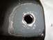 1992 Lincoln Custom - A close-up view shows a vehicle part that has been repaired with grey filler around a central hole.