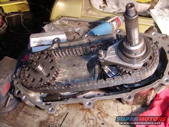 Transfer case with chain and gears, showing a Morse Hy-Vo Chain box and a tube of grease