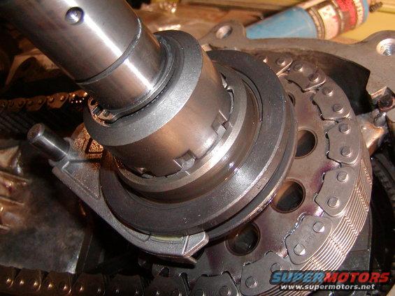 Close-up of timing chain and gears with a metal shaft