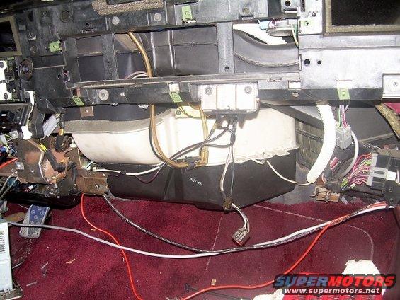 Heater core assembly with wires and hoses, maroon carpet, under dashboard
