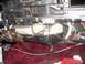 1989 Lincoln Town Car - The heater core assembly is visible with numerous wires and hoses connected, set against a maroon carpeted floor.