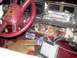 1989 Lincoln Town Car - The dashboard and center console of a car are disassembled, revealing a complex network of wires and components.