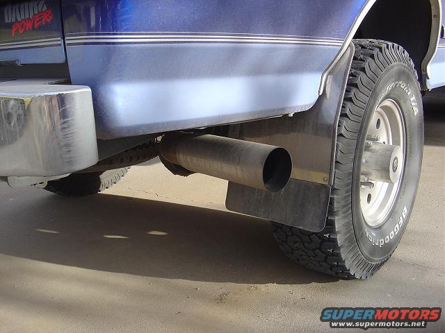 1986 Ford Bronco II rear wheel, exhaust pipe, and mud flap. Red text on fender reads '460 POWER'