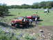 1996 Ford Bronco - Off-roading scene with multiple Jeeps in a natural, outdoor environment.