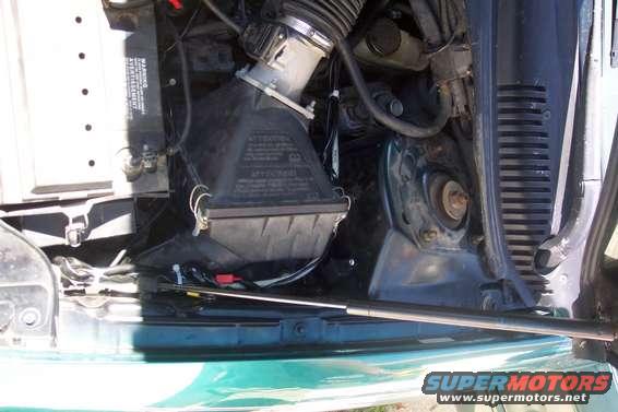 wires on right side of airbox (hard to make wires disappear in this engine bay)*notive the rivet holding everything is place...owe that one to my friend