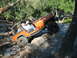 1996 Ford Bronco - A Jeep Wrangler navigates a rocky off-road course, with occupants enjoying the ride.