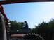 1996 Ford Bronco - A person sits atop a red Jeep Wrangler while another vehicle follows closely behind.