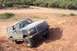 1995 Ford Bronco - This 1995 Ford Bronco navigates a steep, dusty incline during an off-road excursion.