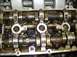 1996 Ford Probe - Close-up view of engine camshafts, showing internal components and oil buildup.