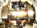 1996 Ford Probe - Engine internal components, likely a valve train, covered in oil.