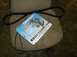 1996 Ford Probe - A Dayco automotive timing belt is shown with its packaging, resting on a chair.