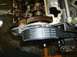 1996 Ford Probe - Close-up of an engine's timing belt and gears, showing part numbers and multilingual instructions.