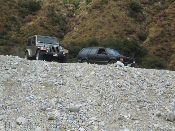 Jeep Wrangler and Chevrolet S-10 Blazer on a rocky incline